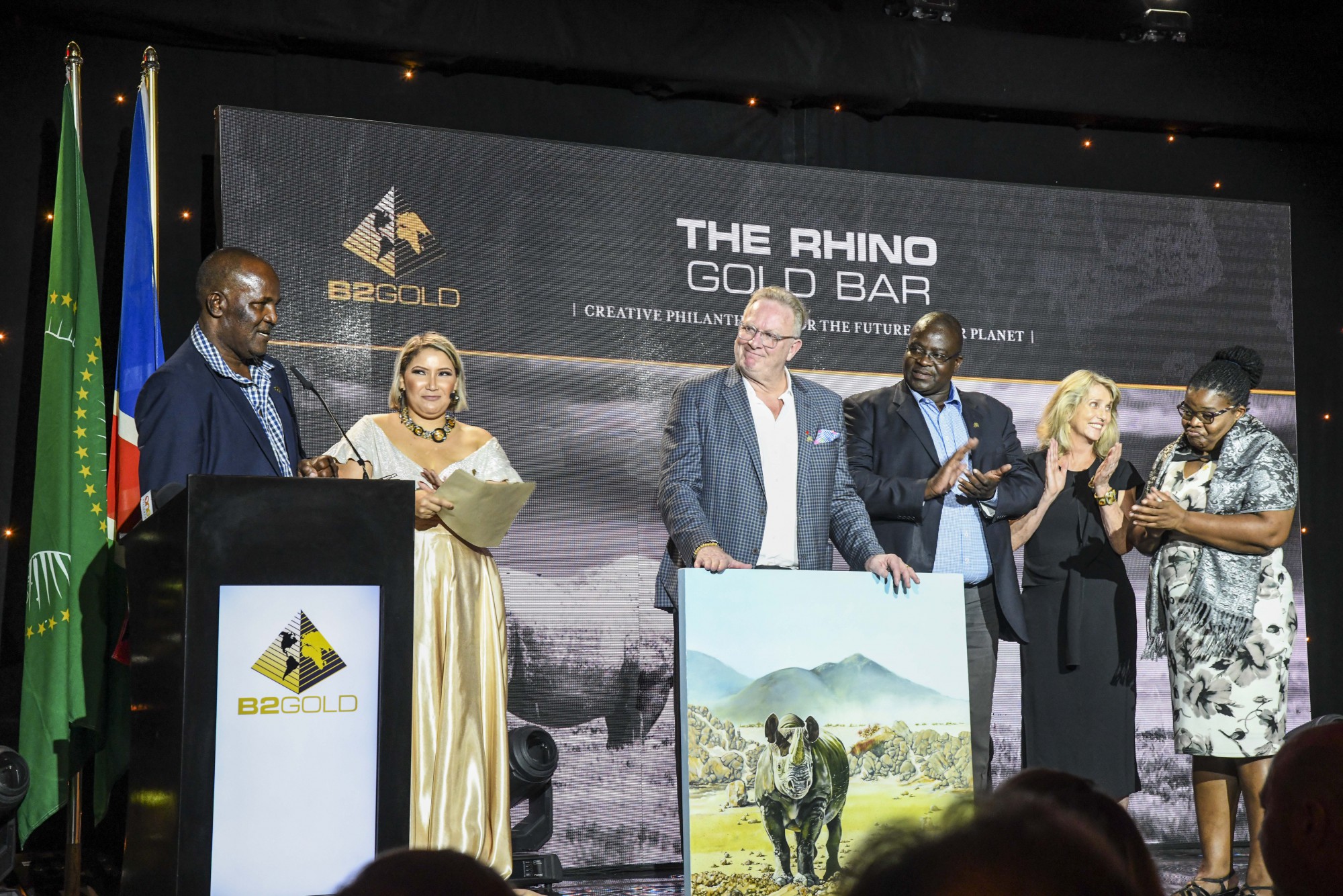 Members from Save the Rhino Trust &ldquo;SRT&rdquo; and Integrated Rural Development and Nature Conservation &ldquo;IRDNC&rdquo; presenting a token of their appreciation to Clive Johnson (President, CEO &amp; Director, B2Gold Corp.).  From left to right: Simson Uri-Khob (CEO, SRT), Clive Johnson, John Kasaona (Executive Director, IRDNC), Ginger Mauney (Director, SRT) and Maxi Louis (Board of Trustees Chairperson, SRT)